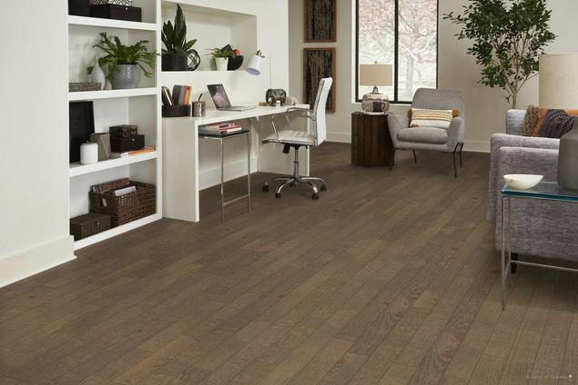 Office with medium brown hickory hardwood floors.